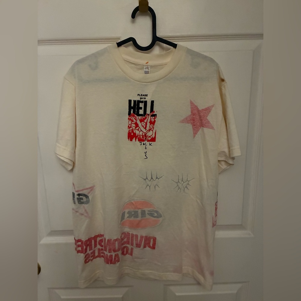 Travis Scott x Cactus Jack Cream T-Shirt with colorful lettering.